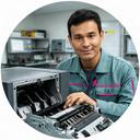 ATM lead engineer checking a dispenser module in a Singapore service room
